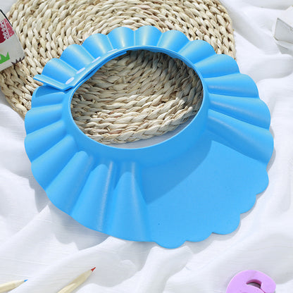 Bonnet de douche bébé imperméable, coloris disponibles